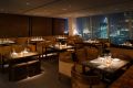 Restaurant tables lit with narrow beam angle downlights